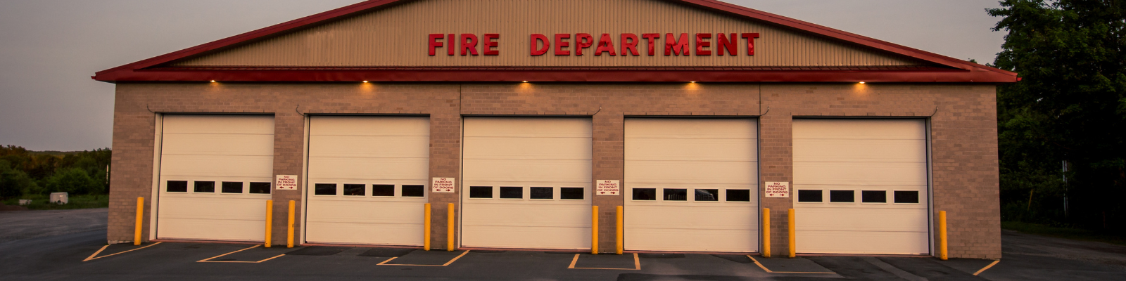 BPFDBanner2 The outside of a fire department, featuring several doors.
